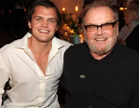 Portrait of Caleb James Goddard smiling in a casual outfit, reflecting his Hollywood background and family legacy.